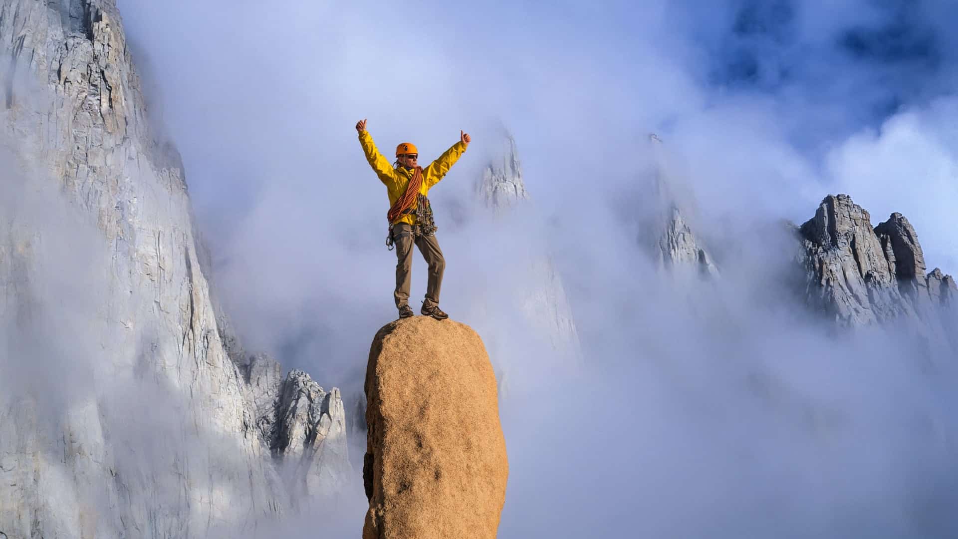 photo of man on mountain top