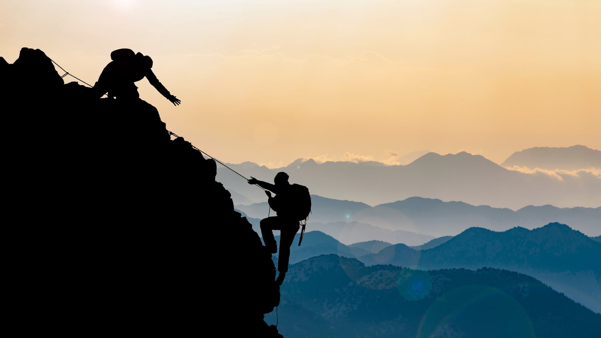 photo of two people on mountain top