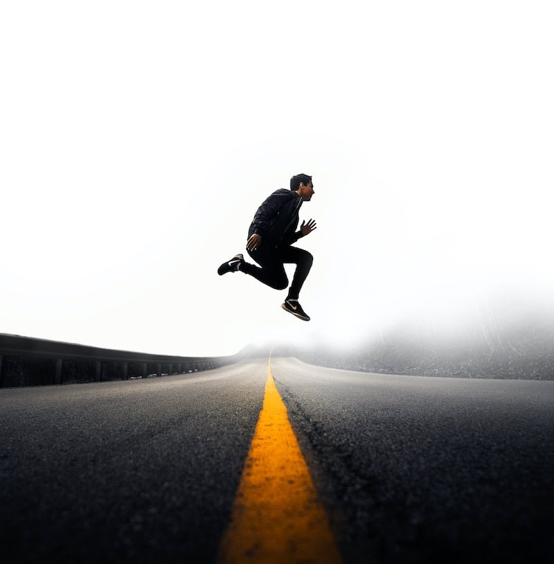 man jumping in road