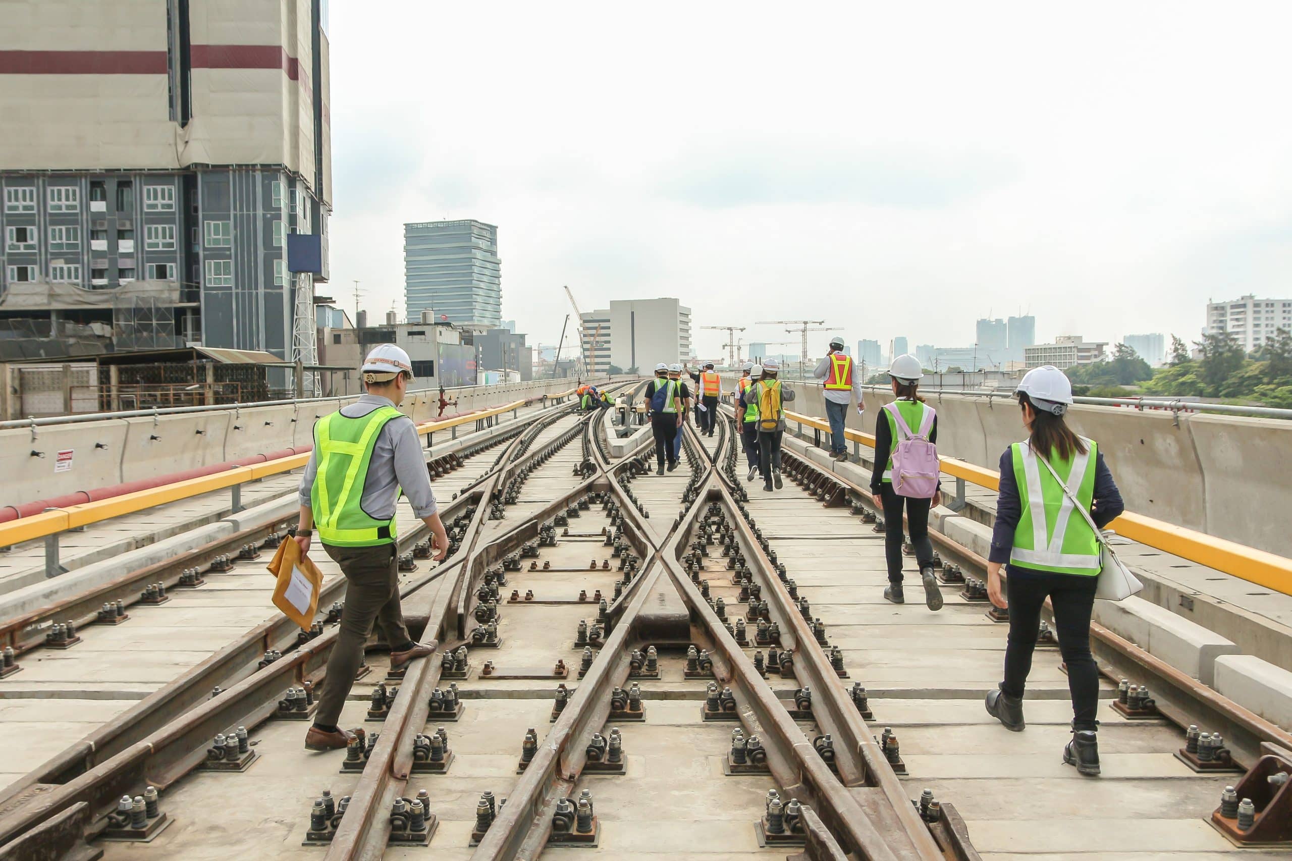 Engineer walk on track or railway on viaduct of sky train for inspect trackwork